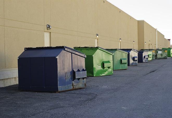 a group of construction workers taking a break near a dumpster in Arnold CA